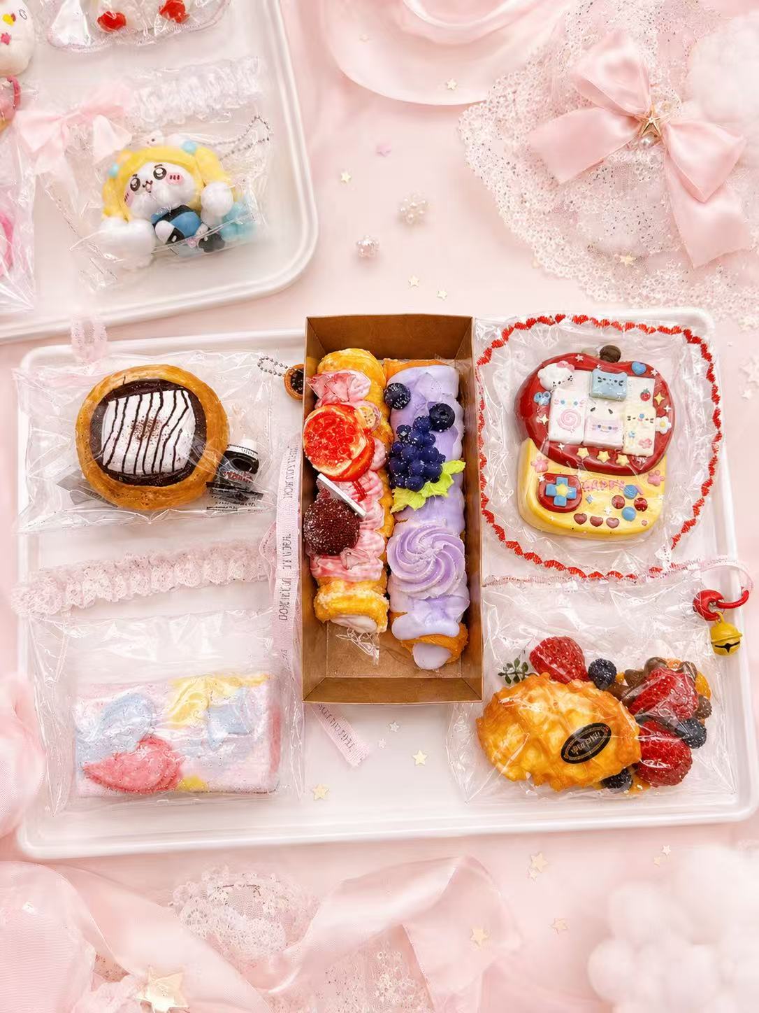 Example food-inspired taba squishies from Pawkemon Squishy Blind Bag, showing handmade silicone dessert, snack, and meal-style squishy designs.