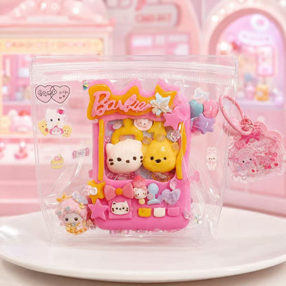 Handmade pink Claw Machine Taba Squishy in transparent packaging with plush character figures and colorful arcade details