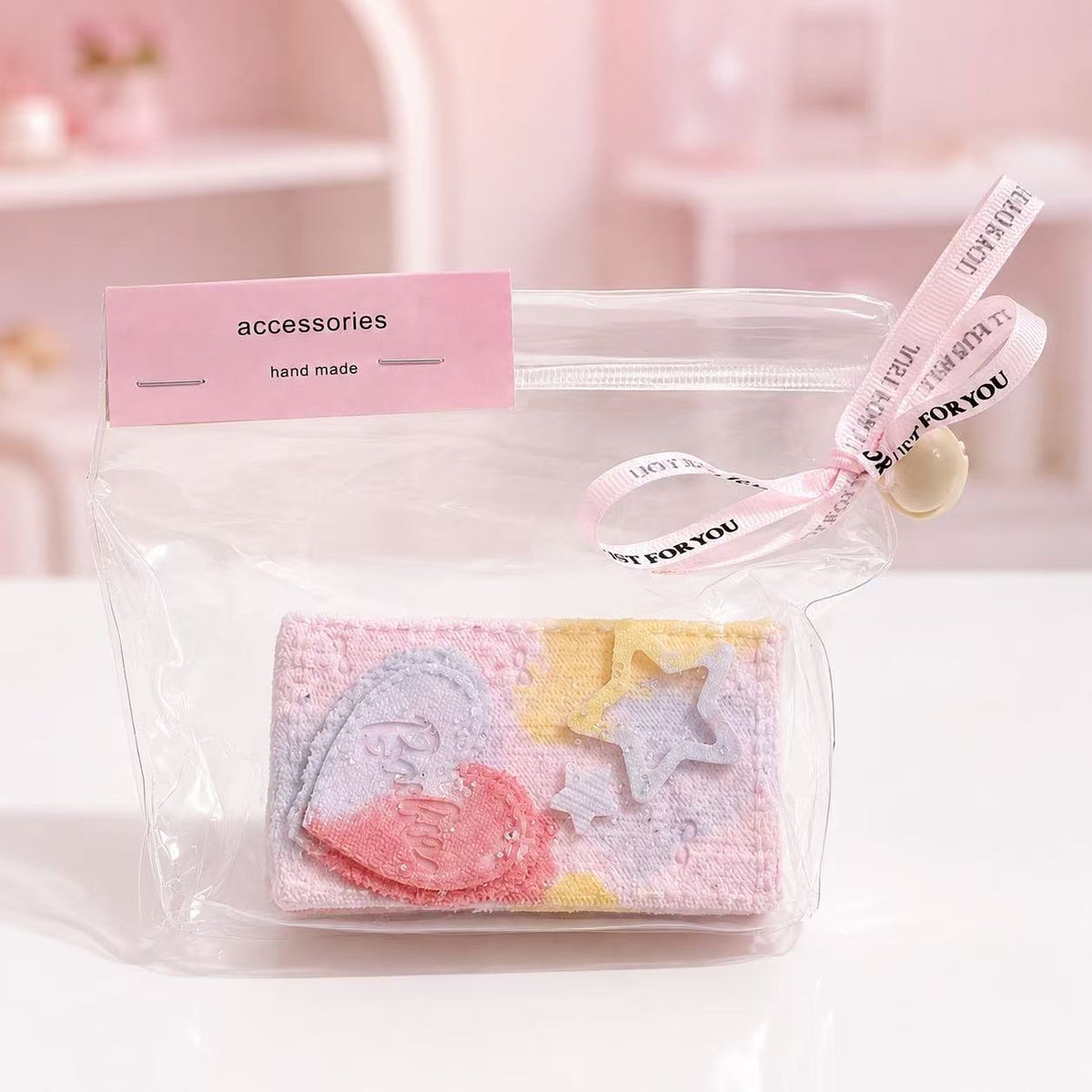 Pink Denim Brick Taba Squishy by Pawkemon Squishy, a handmade silicone brick squishy with denim-style texture, pastel pink and yellow gradient, heart detail, star charm, and clear pouch packaging.