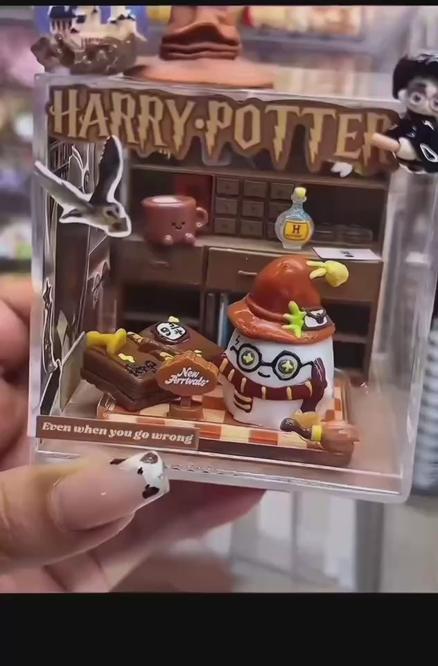 Video showing a handmade magic academy case taba squishy inside a clear acrylic display box from multiple angles
