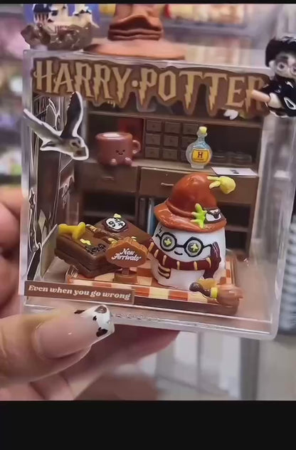 Video showing a handmade magic academy case taba squishy inside a clear acrylic display box from multiple angles
