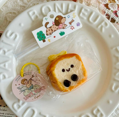 Close-up of puppy toast squishy on white Parisian plate, styled like a gourmet dessert