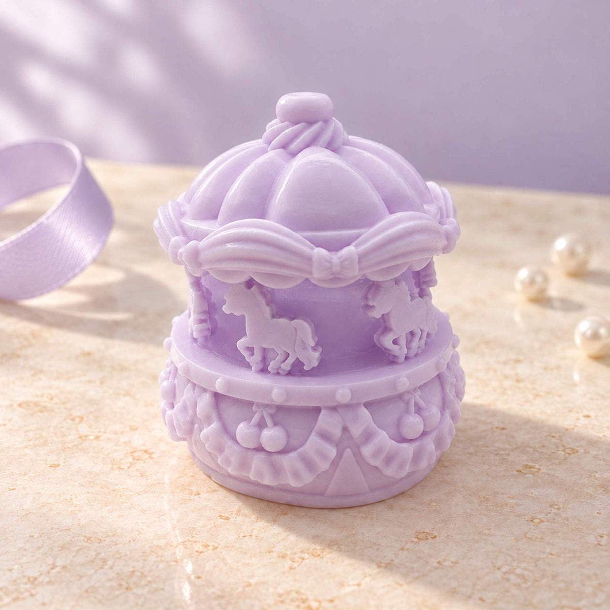 Lavender mini carousel Taba Squishy with raised horse figures, bows and a detailed canopy in soft natural light.