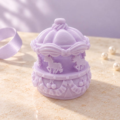 Lavender mini carousel Taba Squishy with raised horse figures, bows and a detailed canopy in soft natural light.