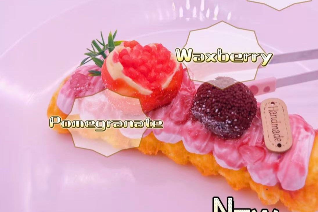 “Ruby Crown Pastry Taba Squishy launch poster — ultra realistic handmade silicone squishy horn pastry topped with waxberry and pomegranate.