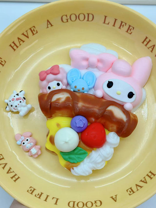 Side view of Sanrio Pizza Taba Squishy featuring melty cheese, cream, blueberry, strawberry, and Sanrio characters on a soft pizza slice.