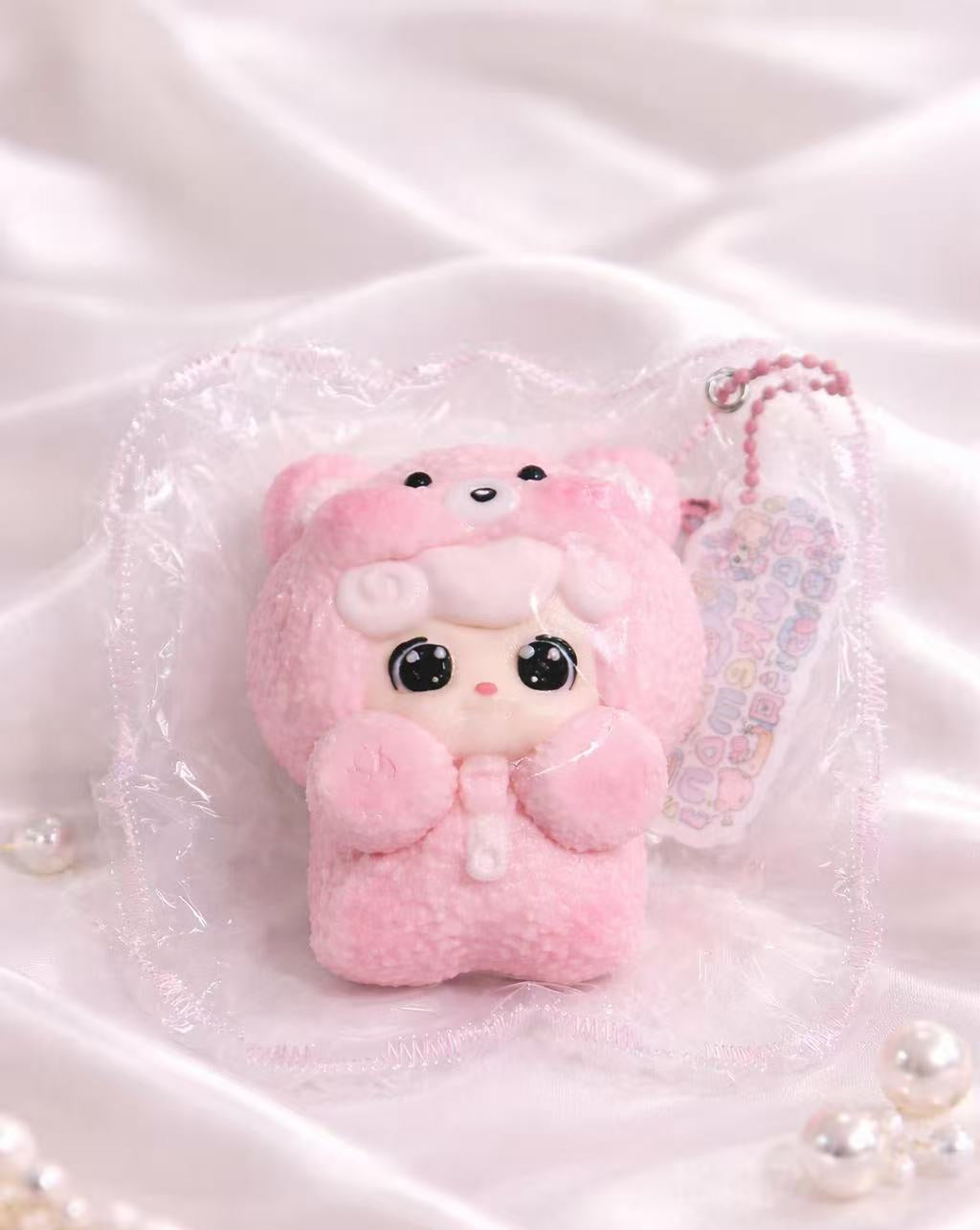 Sleepy Baby Taba Squishy wearing cozy pajamas, handmade silicone squishy with soft pastel colors and cute baby character design