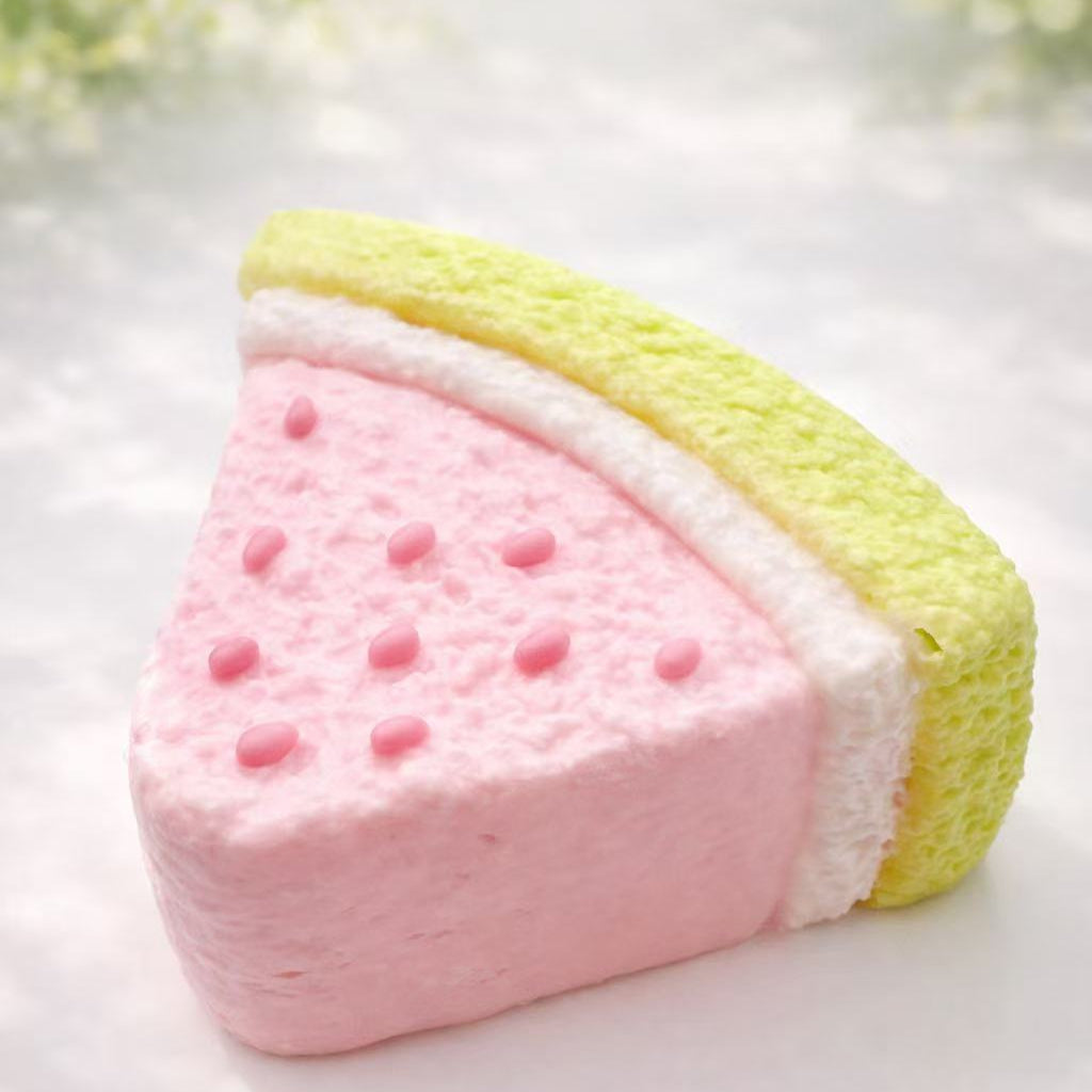 Watermelon cake taba squishy, handmade silicone squishy with pink watermelon cake layers, soft slow rising texture, fresh summer dessert style, clean professional product photography